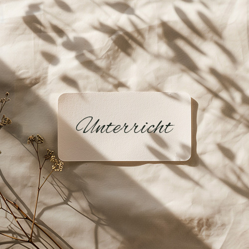 a_single_paper_yoga_class_ticket_on_a_light_natur